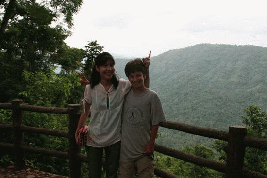 Faang and Paul overlooking the lush, tropical highland forest of Khao Yai National Park.