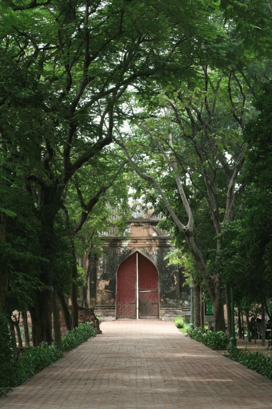 The gate providing access to a summer home with ruins of a former dynasty surrounding the home in Lopburi