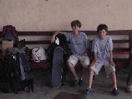 Peter and Paul wait for the south bound bus in Belize City