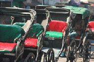 Walking rickshaw driver awaits his next customer in Kolkata