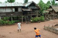 Our guides play Tak Cor, the Laos national game, below our hut. Peter and Paul have become very good at this game.