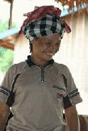 The village gave each person a handicraft gift, which is displayed by a Hmong woman.