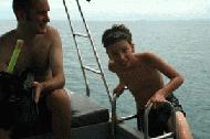 Paul climbs aboard after a successful snorkel trip which included touching a