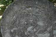 Stone carvings as part of the top plate of a stella.